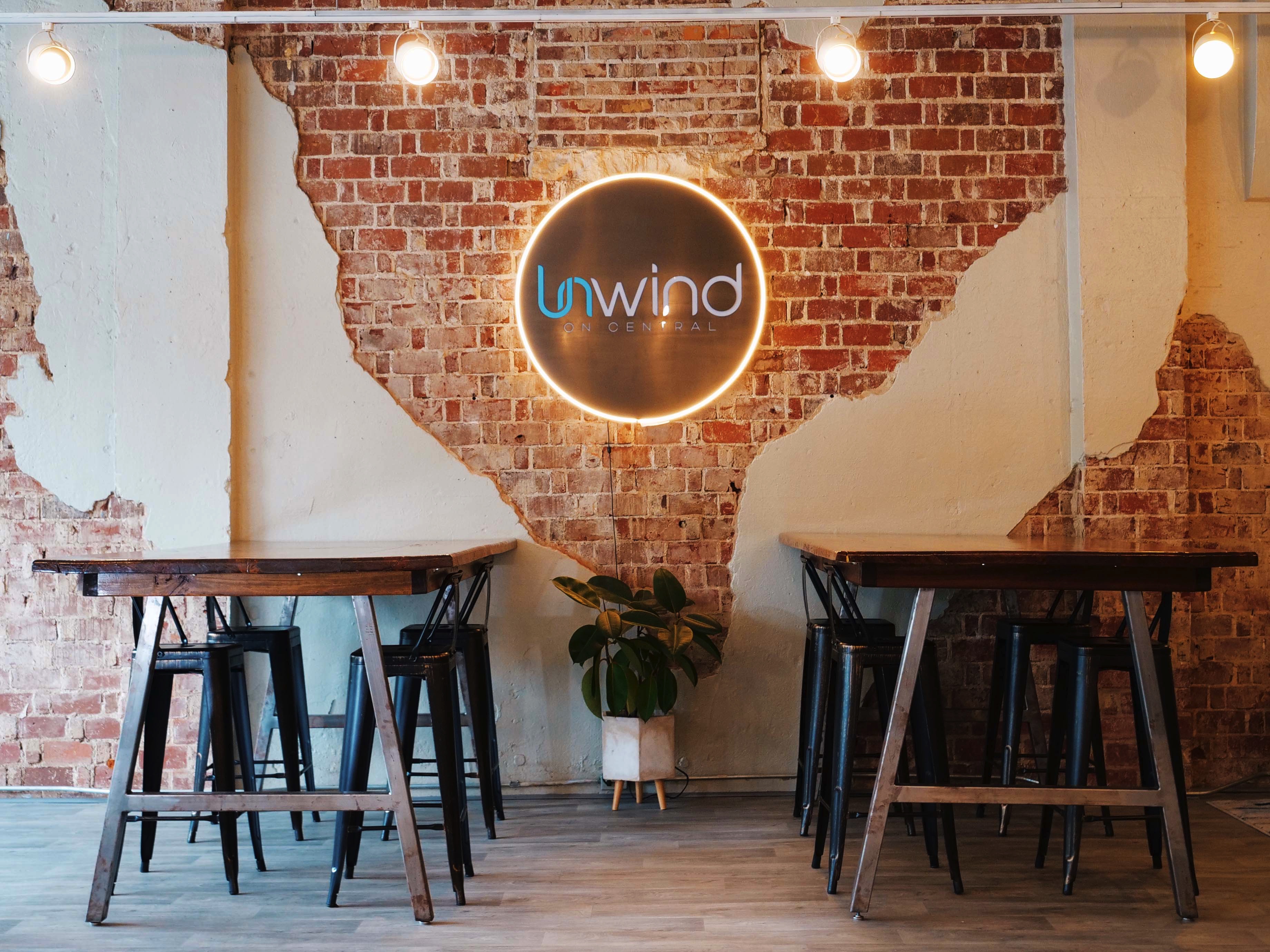 Unwind venue interior with lounge seating and brick walls