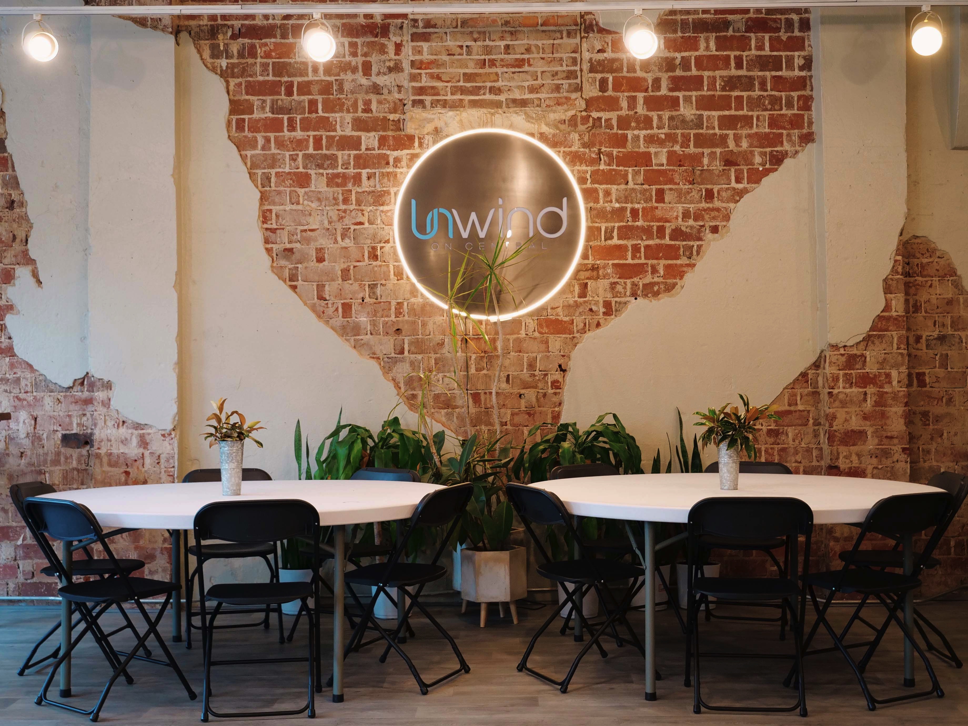 Unwind venue interior with lounge seating and brick walls
