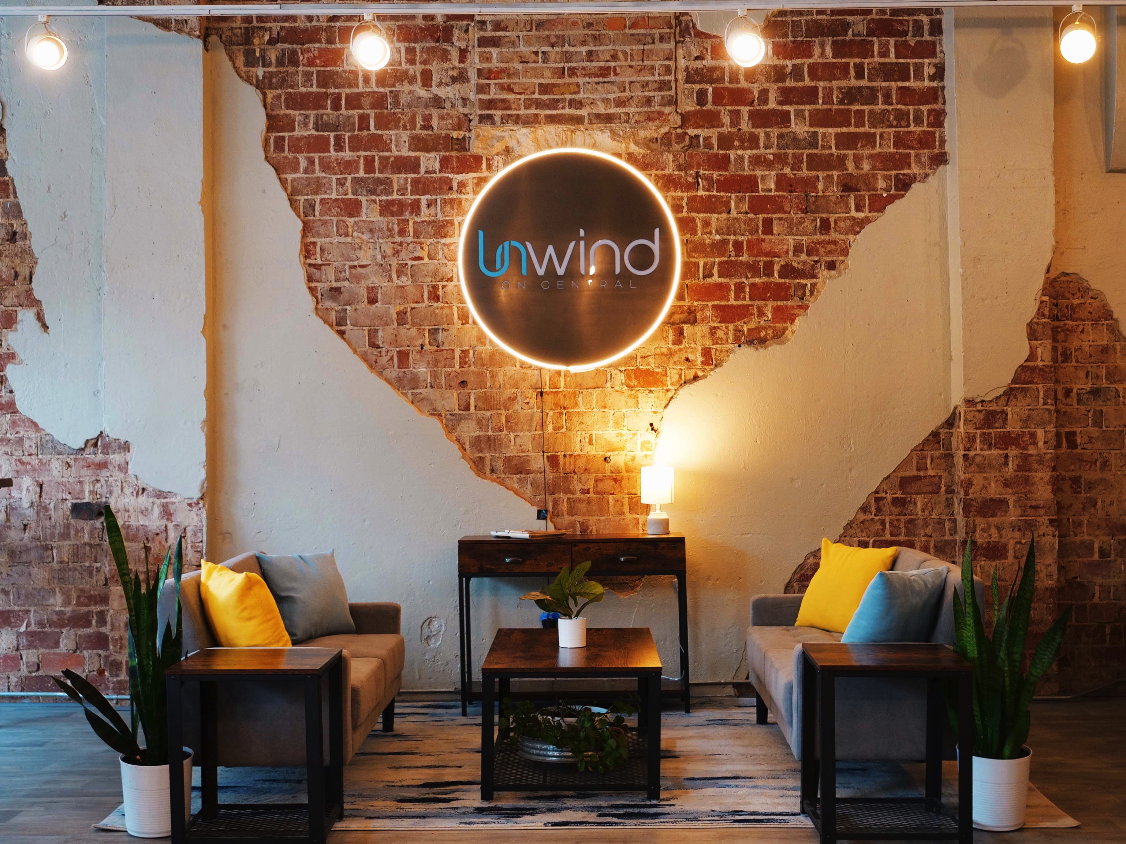 Unwind venue interior with lounge seating and brick walls